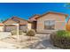 Charming single-story home with a three-car garage, low maintenance landscaping, and neutral color palette at 16837 W Northampton Rd, Surprise, AZ 85374