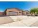 Charming single-story home featuring a three-car garage, low maintenance landscaping, and a wide driveway at 16837 W Northampton Rd, Surprise, AZ 85374