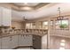 Kitchen featuring granite countertops, white cabinets, and stainless steel appliances at 16837 W Northampton Rd, Surprise, AZ 85374