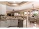 The beautiful kitchen has stainless steel appliances and opens to the breakfast nook at 16837 W Northampton Rd, Surprise, AZ 85374