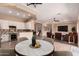 Open concept dining and living area featuring stylish decor and seamless flow into the kitchen at 16837 W Northampton Rd, Surprise, AZ 85374