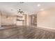 Open-concept living space showcasing a seamless flow between living room, dining area, and kitchen at 16837 W Northampton Rd, Surprise, AZ 85374