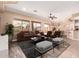 Spacious living room with modern furnishings, ceiling fan, and lots of natural light at 16837 W Northampton Rd, Surprise, AZ 85374