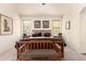 Cozy bedroom featuring a large bed, side tables with lamps, and natural light at 18077 W Sammy Way, Surprise, AZ 85374
