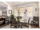 Dining area with glass table and seating, offering a welcoming space for meals at 18077 W Sammy Way, Surprise, AZ 85374