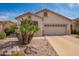 Charming single-story home with a two-car garage, low maintenance landscaping, and a neutral color scheme at 18077 W Sammy Way, Surprise, AZ 85374