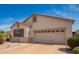 Well-maintained single-Gathering home with a two-car garage, desert landscaping, and inviting curb appeal at 18077 W Sammy Way, Surprise, AZ 85374