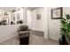 Hallway view showcasing neutral tones and arches that connect to the living room and kitchen areas at 18077 W Sammy Way, Surprise, AZ 85374
