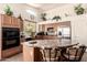 Well-equipped kitchen with island, stainless steel appliances, and plentiful counter space at 18077 W Sammy Way, Surprise, AZ 85374