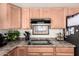 Kitchen area showcasing granite counters and sleek appliances at 18077 W Sammy Way, Surprise, AZ 85374