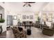 Inviting living room featuring neutral tones, plush seating, and ample natural light at 18077 W Sammy Way, Surprise, AZ 85374