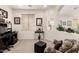 Home office with a desk, chair, and natural light, offering a comfortable workspace for remote work at 18077 W Sammy Way, Surprise, AZ 85374