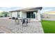 Open backyard featuring a covered patio, outdoor seating, artificial turf and block wall at 18100 N Piccolo Dr, Maricopa, AZ 85138
