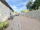 Well-maintained backyard with gravel, pavers, a seating area and a block wall at 18100 N Piccolo Dr, Maricopa, AZ 85138