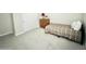 Neutral bedroom featuring a twin bed, dresser, and bright, natural light at 18100 N Piccolo Dr, Maricopa, AZ 85138