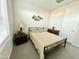 Bedroom featuring a metal frame bed, decor, and a large window at 18100 N Piccolo Dr, Maricopa, AZ 85138