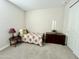 Bedroom with carpet, window and single bed with dark-stained chest of drawers at 18100 N Piccolo Dr, Maricopa, AZ 85138
