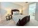 Cozy bedroom featuring a comfortable bed flanked by end tables and lamps, creating a relaxing ambiance at 18100 N Piccolo Dr, Maricopa, AZ 85138