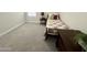 Bedroom with carpet, window and single bed with side table and chest of drawers at 18100 N Piccolo Dr, Maricopa, AZ 85138