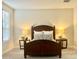 This bedroom features a full size bed, side tables, and neutral-toned walls and carpet at 18100 N Piccolo Dr, Maricopa, AZ 85138