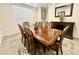 Elegant dining room featuring a wood table, chairs, and a buffet cabinet with decor at 18100 N Piccolo Dr, Maricopa, AZ 85138