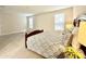 Large main bedroom with neutral colors and a bed placed to highlight the expansive room at 18100 N Piccolo Dr, Maricopa, AZ 85138