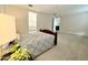 Spacious main bedroom with a bed and view into the attached bath and large open space at 18100 N Piccolo Dr, Maricopa, AZ 85138