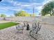 View of the outdoor seating area featuring a paver patio, artificial grass and privacy block wall at 18100 N Piccolo Dr, Maricopa, AZ 85138