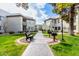 Green courtyard featuring a walkway, benches and BBQ grills, promoting a relaxing community experience at 1825 W Ray Rd # 2132, Chandler, AZ 85224
