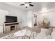 Bright living room featuring modern furniture, neutral tones, and a ceiling fan at 1825 W Ray Rd # 2132, Chandler, AZ 85224