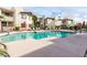 Community pool surrounded by lounge chairs and well-kept landscaping, perfect for relaxation at 1825 W Ray Rd # 2132, Chandler, AZ 85224