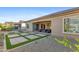 Well-maintained backyard with a covered patio and landscaped gravel at 19045 N 269Th Dr, Buckeye, AZ 85396