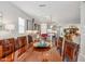 Open dining room with a large wood table connecting to the modern kitchen and living space at 19045 N 269Th Dr, Buckeye, AZ 85396