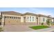 Stylish home features a well-maintained desert landscape, two-car garage, and a tiled roof at 19045 N 269Th Dr, Buckeye, AZ 85396