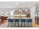 Stylish kitchen with granite countertops, stainless steel appliances, a large island, and pendant lighting at 19045 N 269Th Dr, Buckeye, AZ 85396