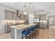Contemporary kitchen featuring granite countertops, stainless steel appliances, and pendant lights over an island at 19045 N 269Th Dr, Buckeye, AZ 85396