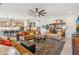 Open-concept living area boasts recessed lighting, a ceiling fan, and stylish furnishings for a comfortable atmosphere at 19045 N 269Th Dr, Buckeye, AZ 85396