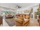 Spacious living room showcases an open layout, contemporary decor, and a seamless flow to the adjacent kitchen at 19045 N 269Th Dr, Buckeye, AZ 85396