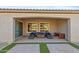 Covered patio featuring an outdoor seating area with a cushioned sectional and neutral patio tiles at 19045 N 269Th Dr, Buckeye, AZ 85396