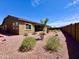 Low maintenance backyard design with gravel, desert landscaping, and a secure block wall at 20171 W Cheery Lynn Rd, Buckeye, AZ 85396