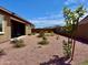 Charming backyard with gravel landscaping, desert plants, and a private, peaceful setting at 20171 W Cheery Lynn Rd, Buckeye, AZ 85396