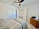 Cozy bedroom with a bed, dresser, and closet at 20171 W Cheery Lynn Rd, Buckeye, AZ 85396