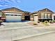 Charming single-story home with a three-car garage and well-manicured front yard at 20171 W Cheery Lynn Rd, Buckeye, AZ 85396