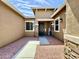 Inviting front entrance with a modern door, stylish stonework, and desert landscaping at 20171 W Cheery Lynn Rd, Buckeye, AZ 85396