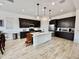 Modern kitchen with a large island, stainless steel appliances, and ample cabinet space at 20171 W Cheery Lynn Rd, Buckeye, AZ 85396