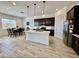 Bright kitchen featuring an island, stainless appliances, and adjacent dining area at 20171 W Cheery Lynn Rd, Buckeye, AZ 85396