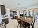 Open-concept kitchen and dining area with an island, stainless appliances, and tile flooring at 20171 W Cheery Lynn Rd, Buckeye, AZ 85396