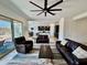 Bright living room boasts a ceiling fan, tile floors, and seamless flow to the kitchen at 20171 W Cheery Lynn Rd, Buckeye, AZ 85396