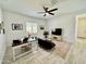 Inviting living room with tile floors, a ceiling fan, and an abundance of natural light at 20171 W Cheery Lynn Rd, Buckeye, AZ 85396