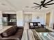 Cozy living space with tile floors, a ceiling fan, and ample seating at 20171 W Cheery Lynn Rd, Buckeye, AZ 85396